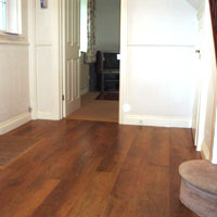 Karndean flooring fitted throughout hallway into bathroom, with coir matting fitted to the right of picture.